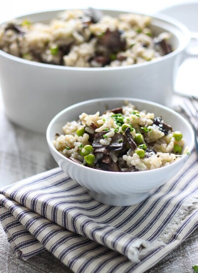 Some slow cooker mushroom risotto in a white bowl.
