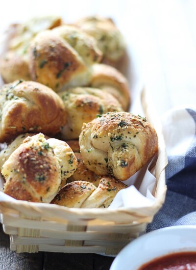Love garlic knots? Make these easy Parmesan garlic knots at home with a simple cheat! Ready in under 30 minutes.