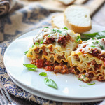 Make some individual sized meaty and cheesy lasagna roll ups. A fun twist on the classic with enough to serve a crowd.