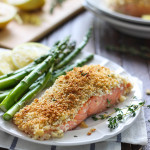 A plate of lemon Parmesan crusted salmon with asparagus on the side.