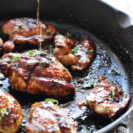 Honey garlic chicken in a cast iron pan.