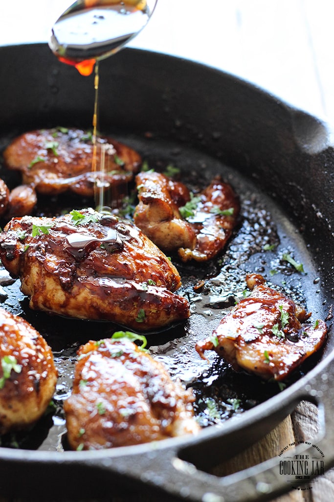 Honey garlic chicken in a cast iron pan.