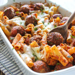 Meatball pasta bake in a white casserole dish.