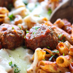 A close up shot of meatball pasta bake with lots of fresh mozzarella cheese.