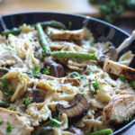 A bowl of lemon pepper chicken alfredo pasta.