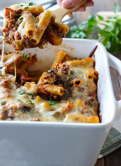 This pizza pasta casserole has all the flavors of pizza you love in casserole form. With tons of mozzarella cheese and lots of cheese strings!
