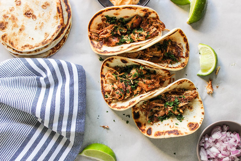 Set and forget these slow cooker shredded chicken tacos then enjoy fork-tender, authentic tasting, flavorful chicken. Pair it with your favorite toppings!