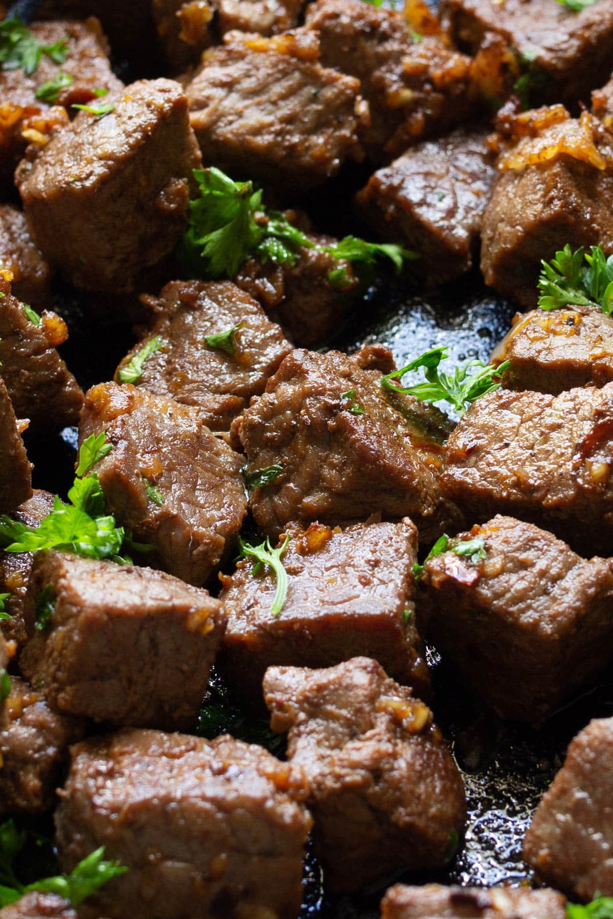 A close up of garlic butter steak bites.