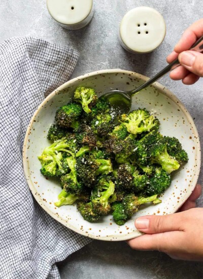 A bowl of crispy air fryer garlic Parmesan broccoli.