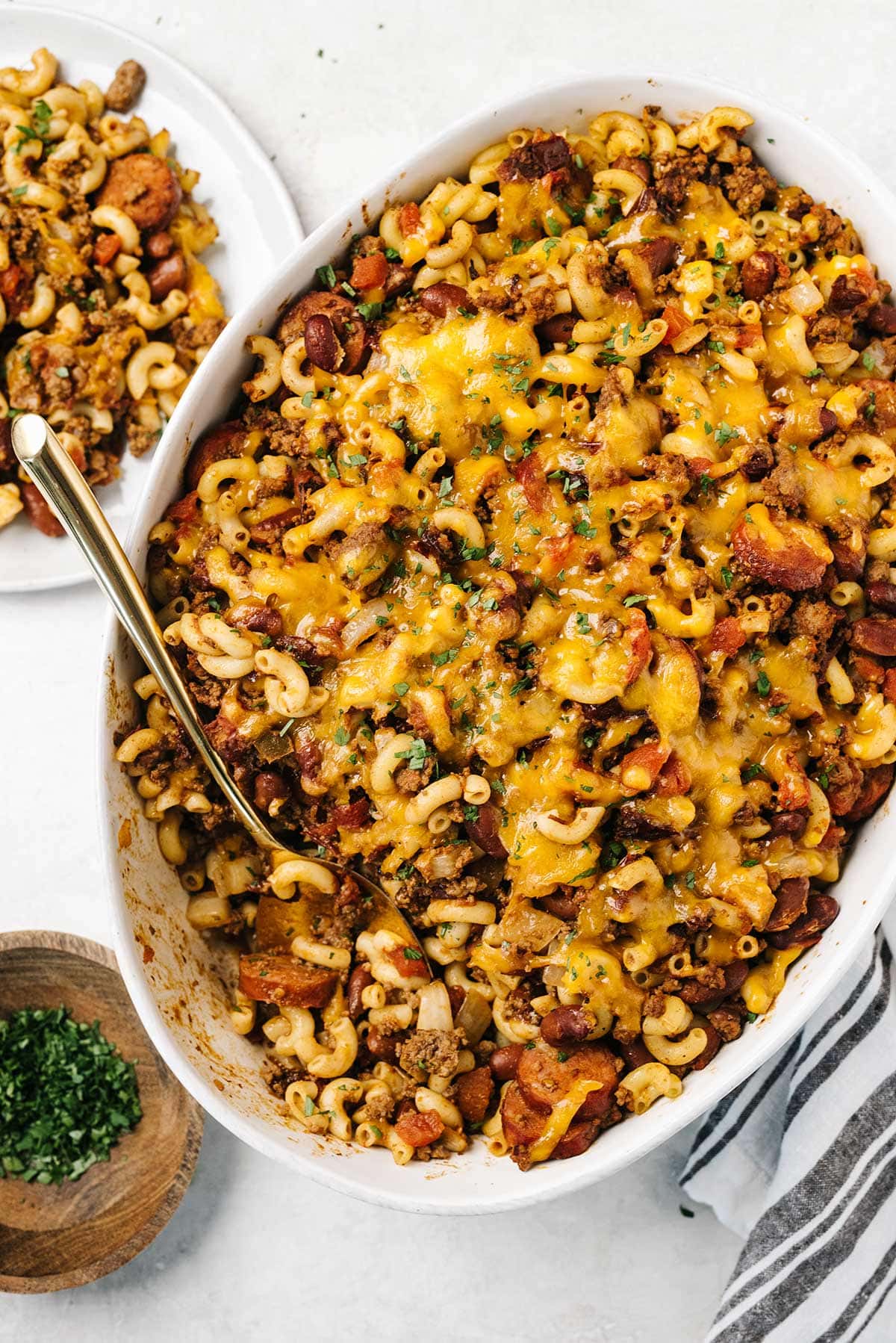 Chipotle chili mac and cheese on an oval white casserole dish.