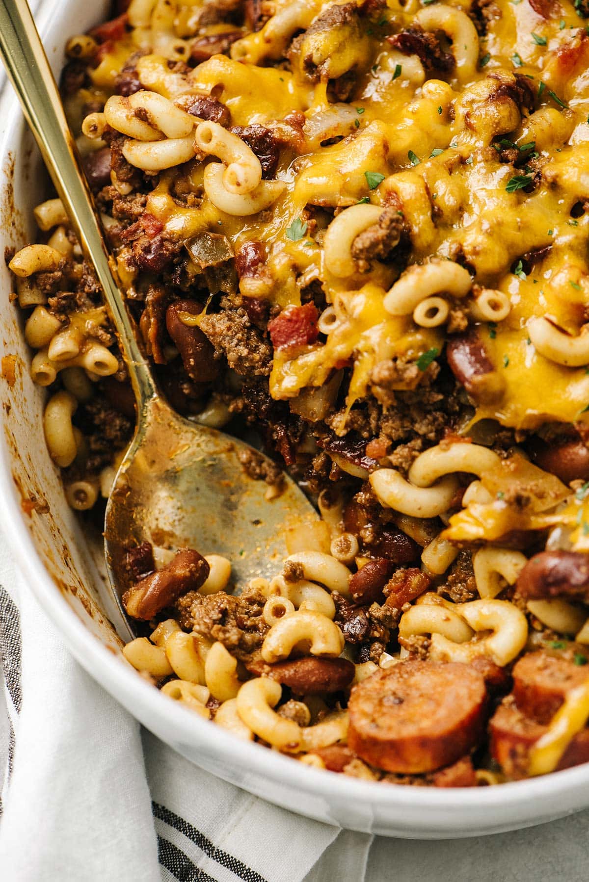 Chipotle chili mac and cheese in an oval white casserole dish.