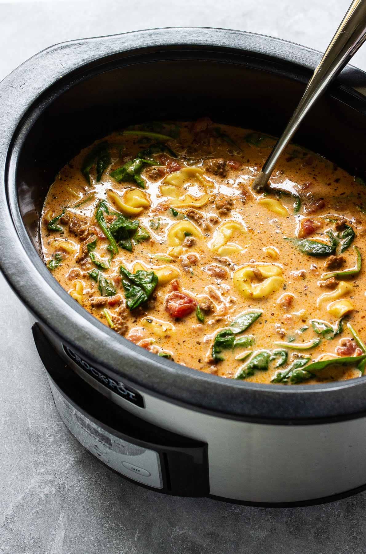 Slow cooker creamy tortellini soup in slow cooker.