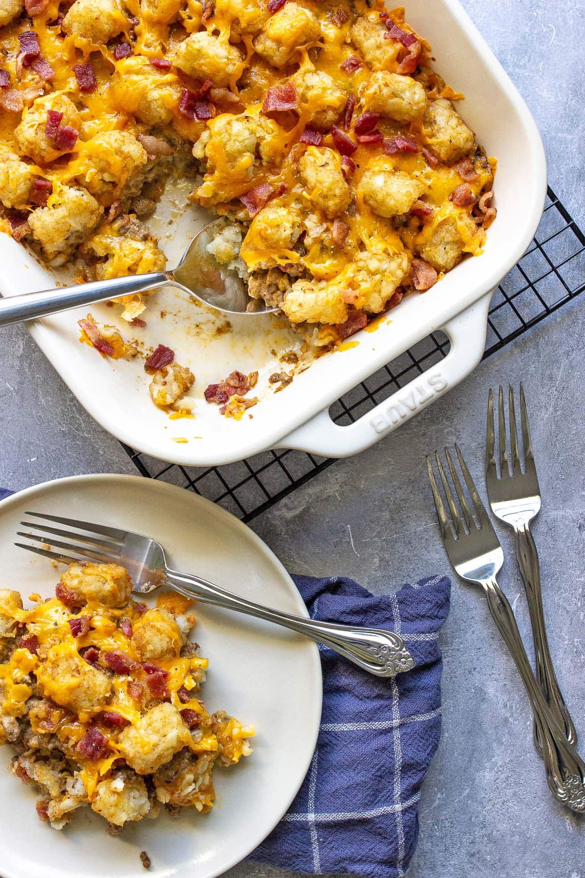 Bacon cheeseburger tater tot casserole in a white casserole dish.