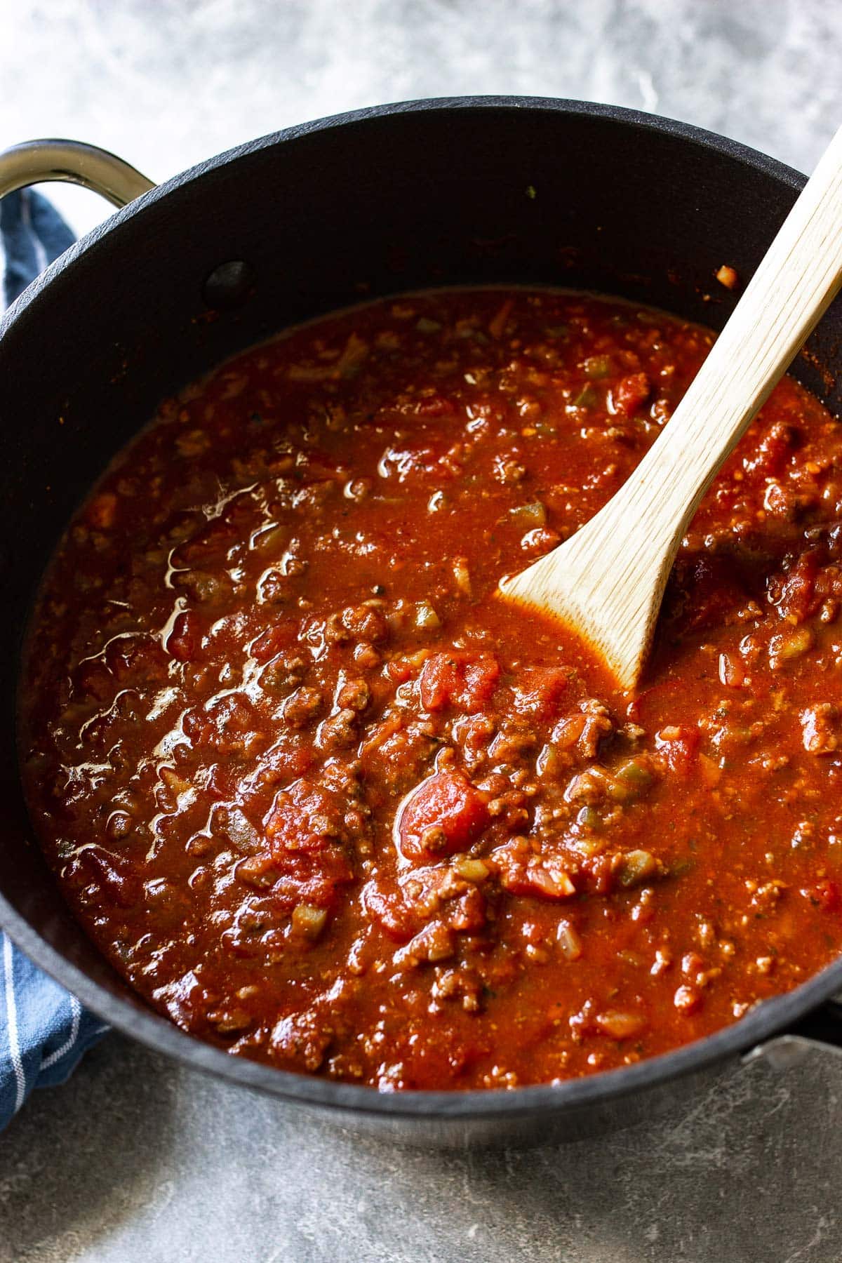 A big batch of homemade spaghetti sauce in a dutch oven.