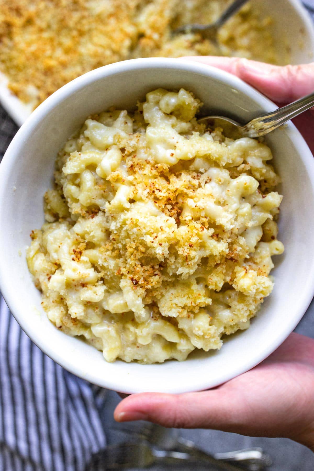 Baked mac and cheese in a white bowl.