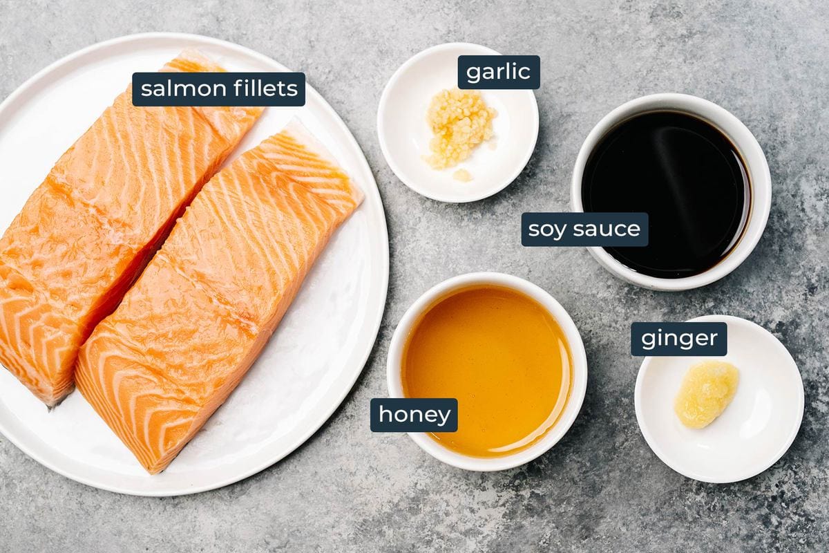 Ingredients to make honey garlic salmon in prep bowls.