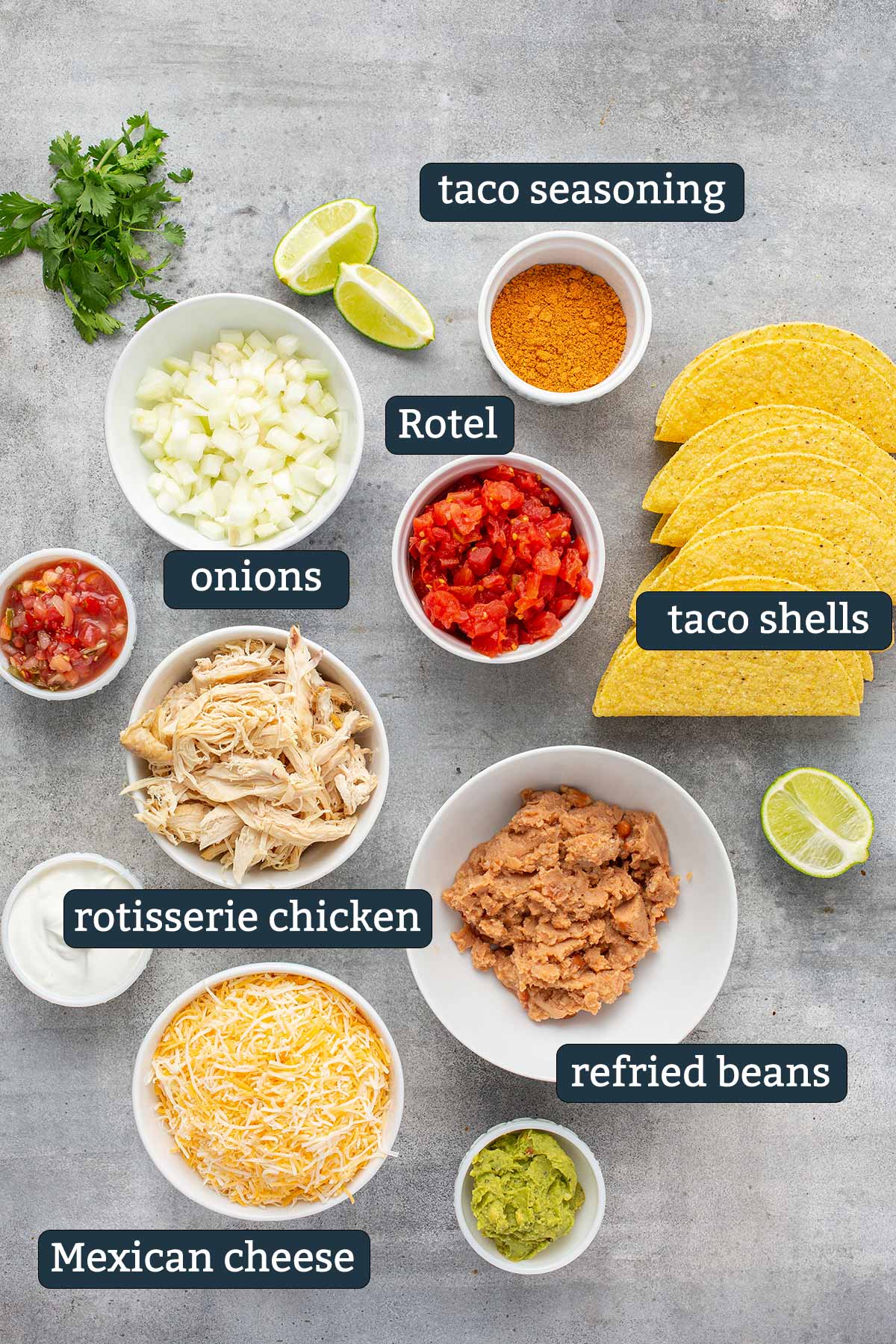Ingredients to make cheesy baked chicken tacos in prep bowls.