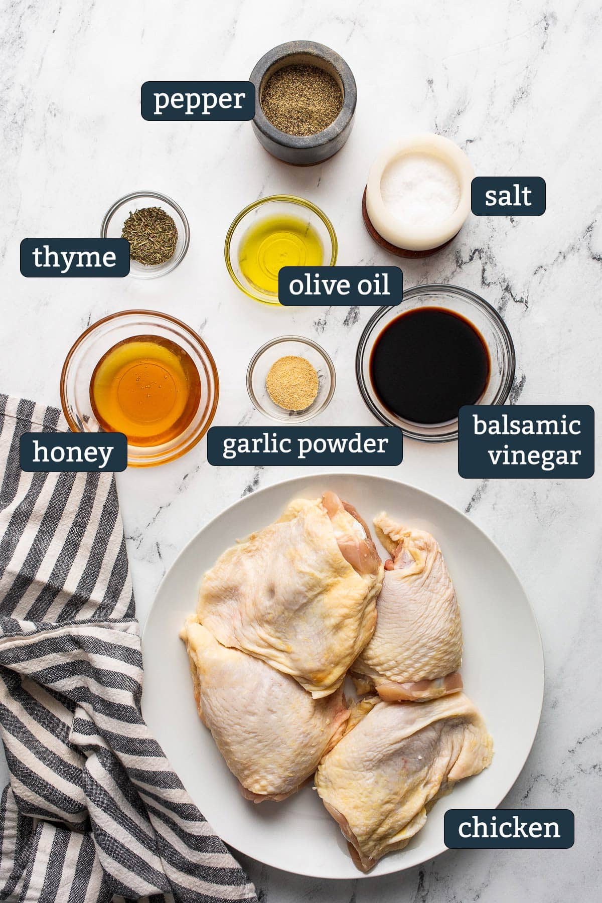 Ingredients to make baked honey balsamic chicken in prep bowls.
