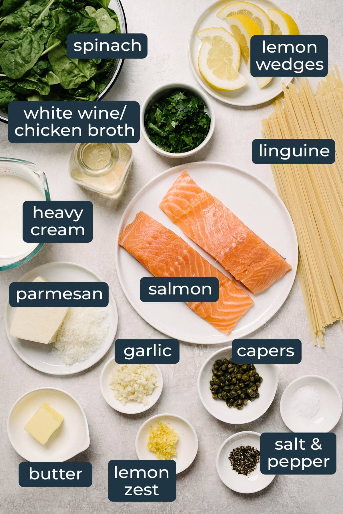 Ingredients to make creamy salmon pasta in prep bowls.