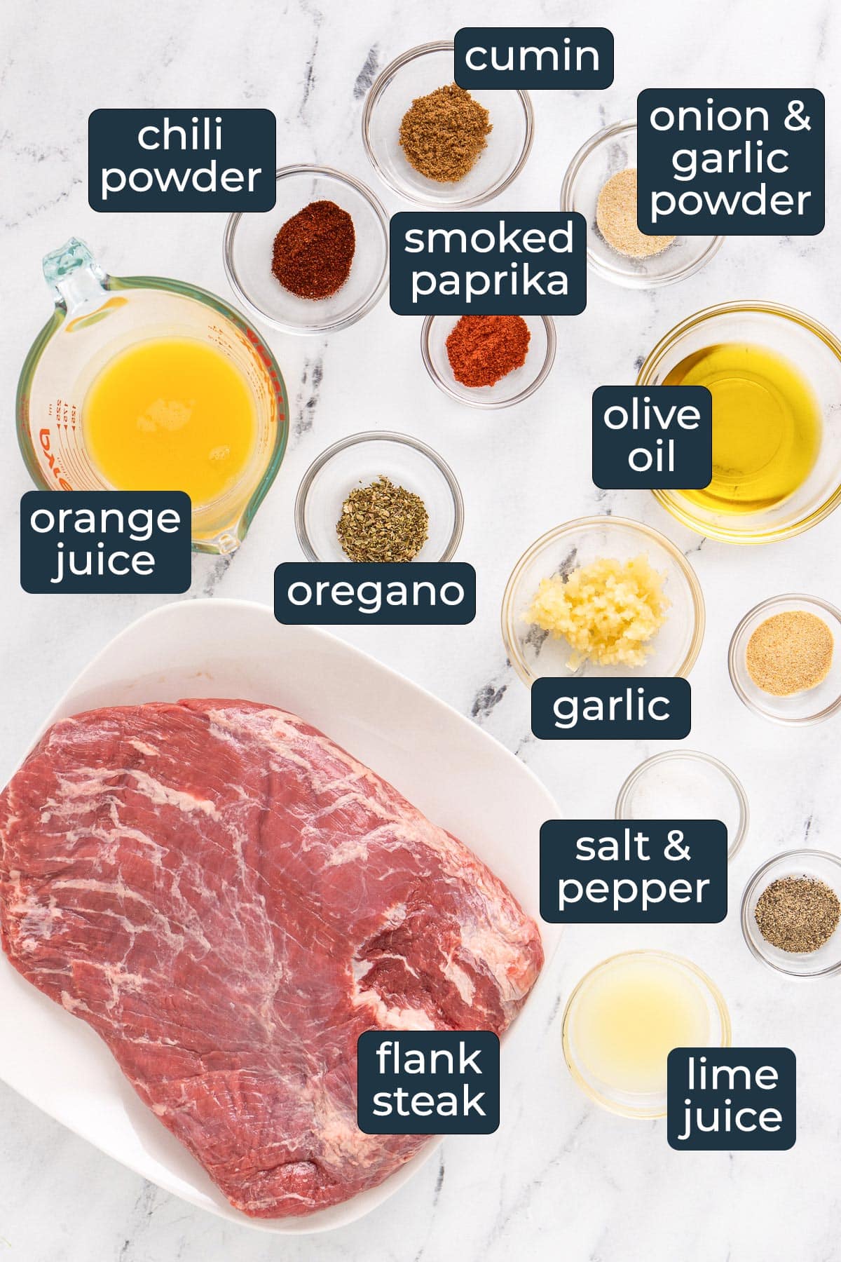 Ingredients to make slow cooker carne asada in glass prep bowls.