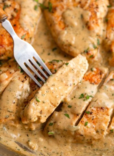 Creamy ranch chicken sliced into bite-sized pieces and smothered in sauce and topped with chopped fresh parsley.