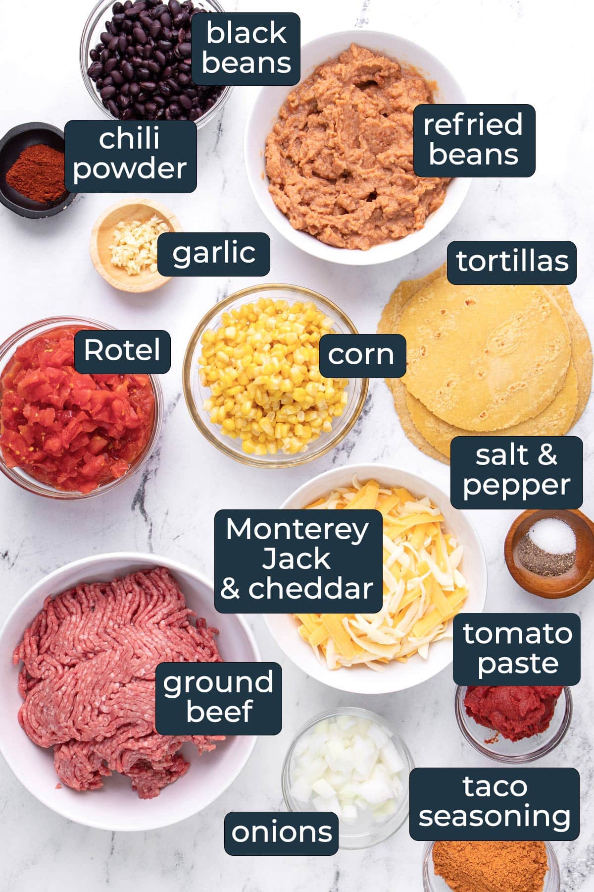 Ingredients to make Mexican ground beef casserole in prep bowls.