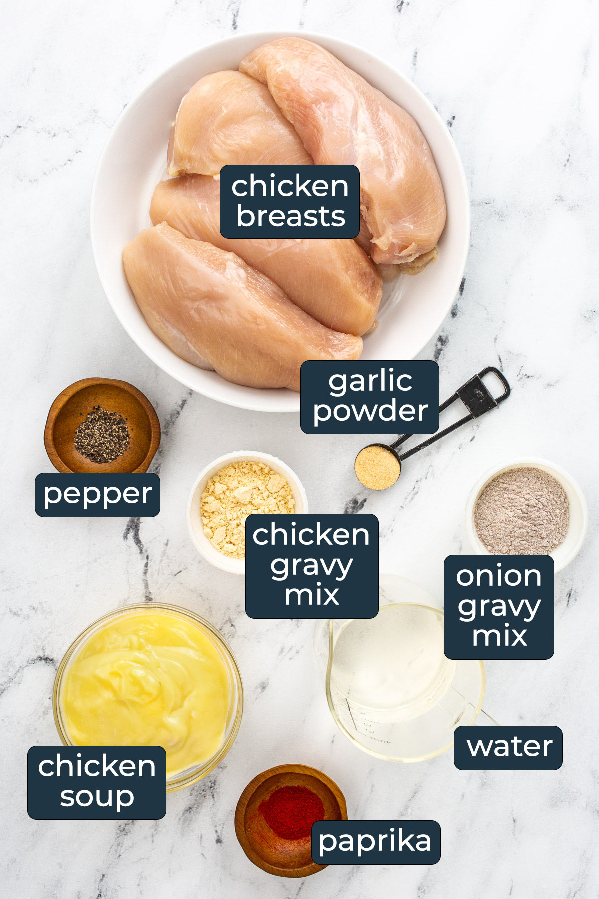 Ingredients to make slow cooker chicken and gravy in prep bowls.