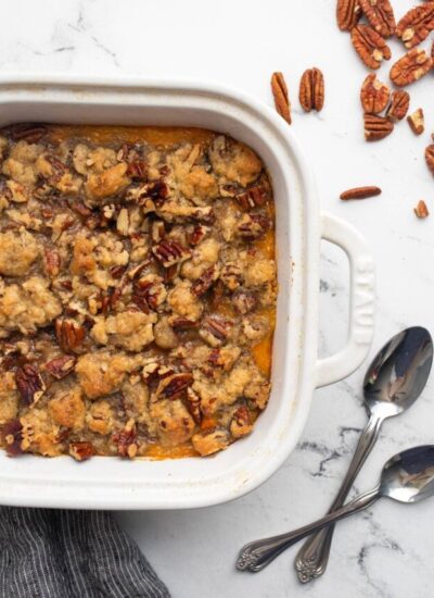 Sweet potato casserole in a white 9x9 baking dish.