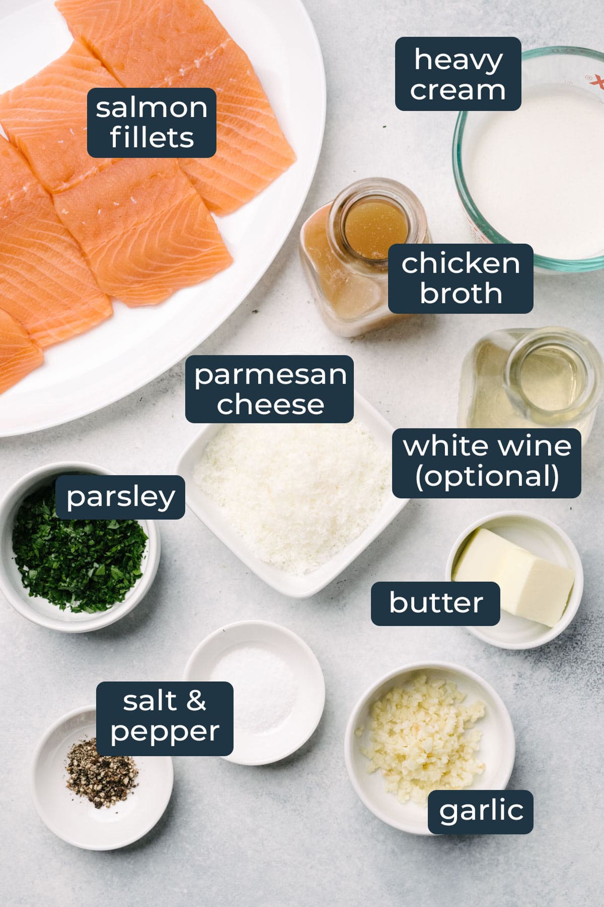 Ingredients to make creamy garlic butter salmon in prep bowls.