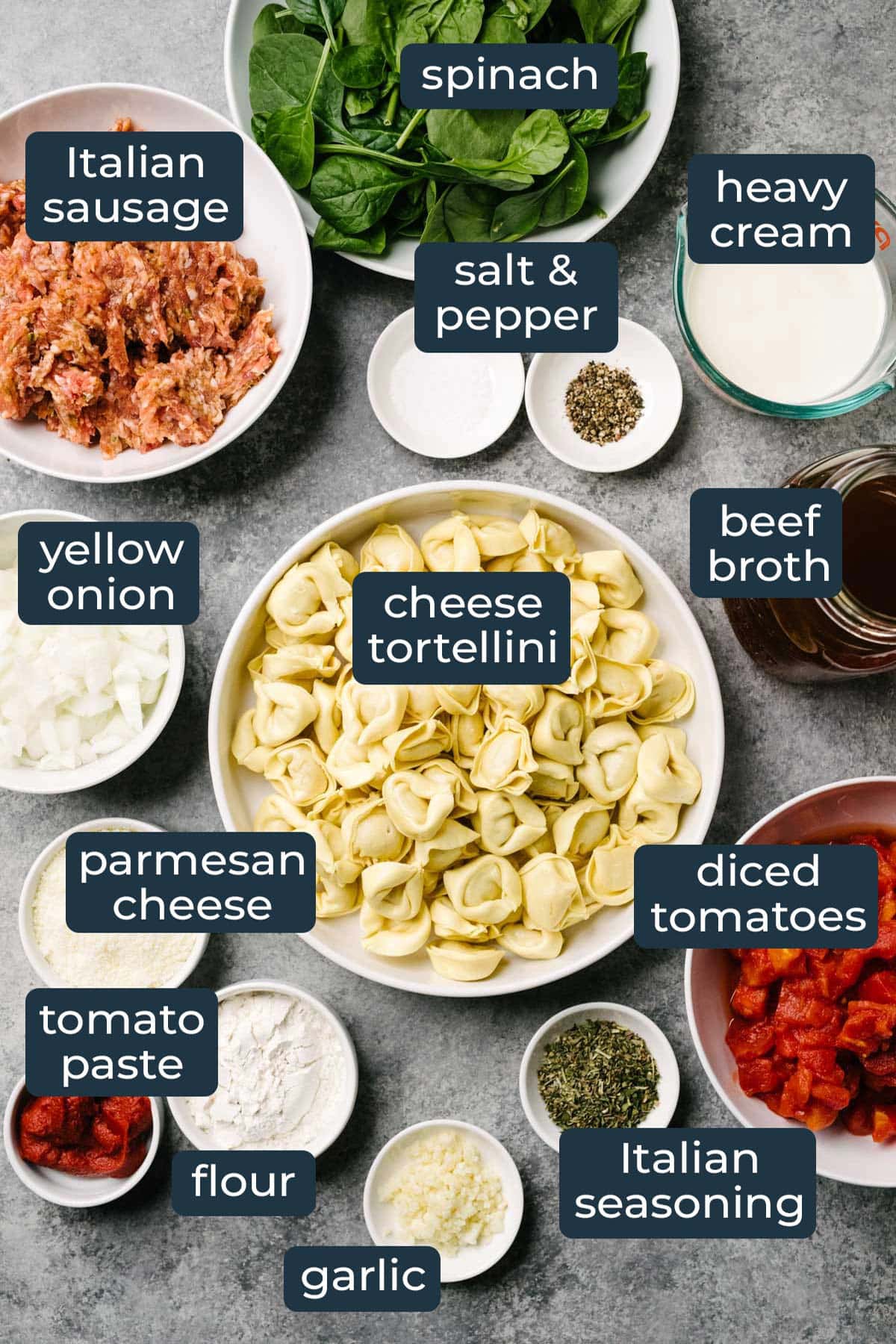 Ingredients to make slow cooker creamy tortellini soup in prep bowls.