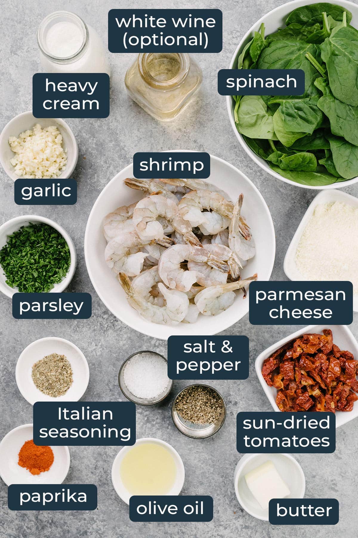 Ingredients to make creamy garlic Tuscan shrimp in prep bowls.