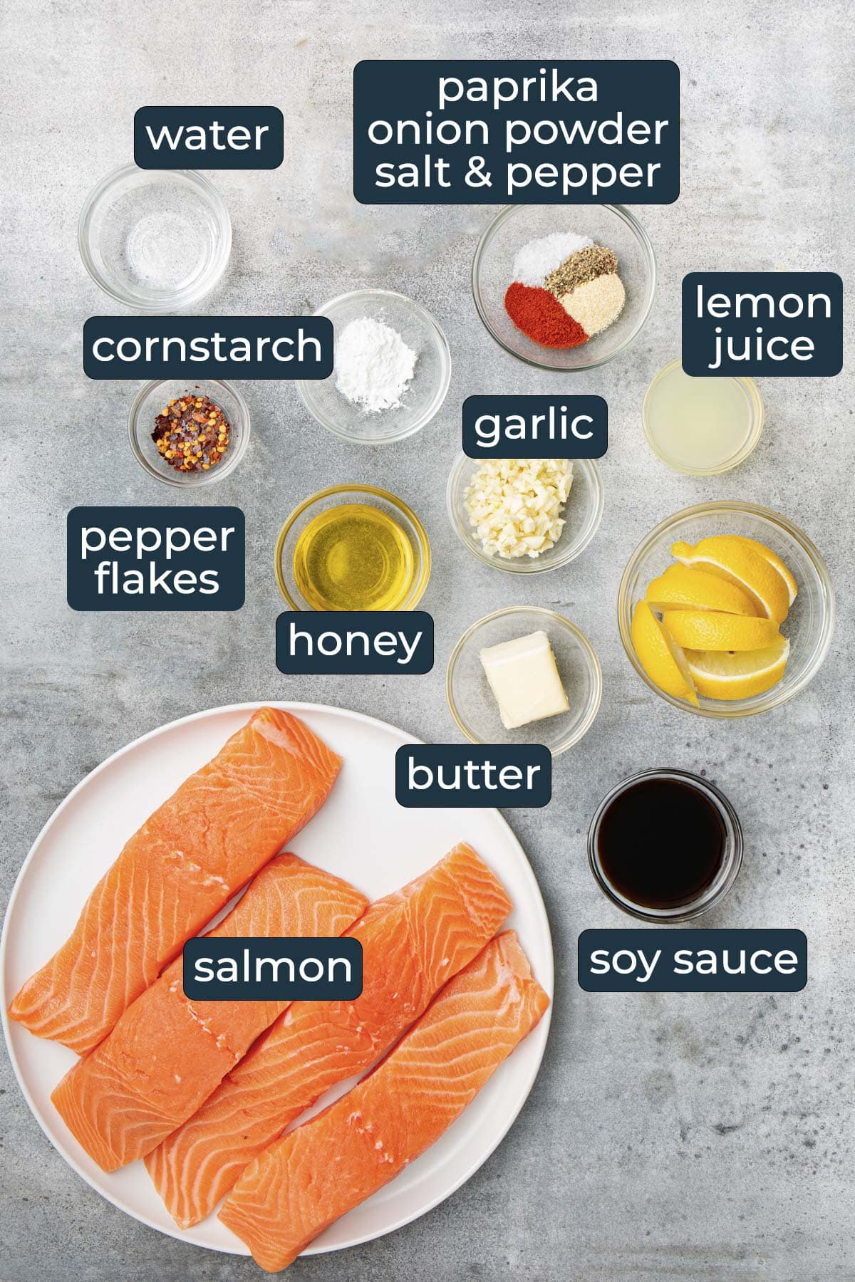 Ingredients for making honey glazed salmon in prep bowls.